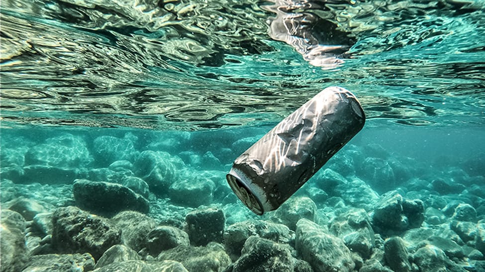 Aluminum can thrown overboard into the water.